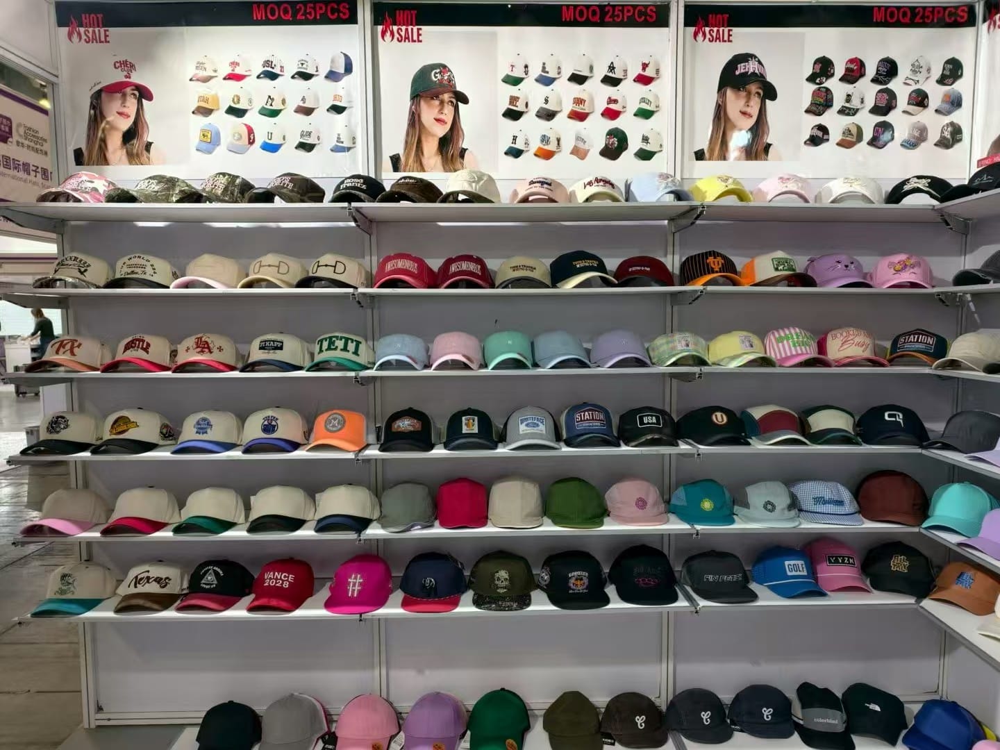 Exhibition booth showcasing baseball caps and snapback hats collection